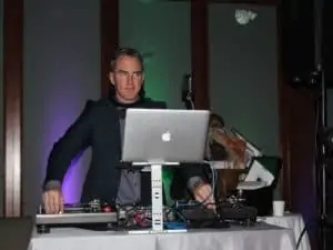 Man DJing with controllers