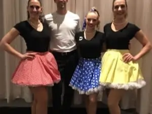 Women with short shirts and a man