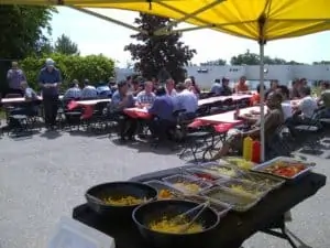 BBQ and benches in parking lot