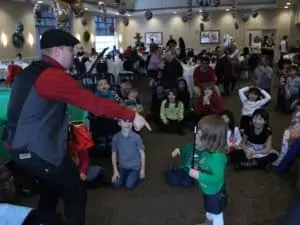 Magician in room with kids