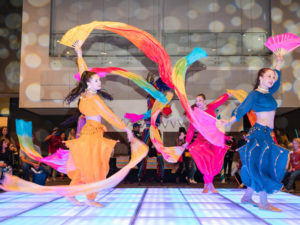 Bollywood dancers with silk flags