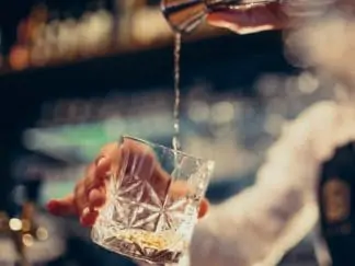 Whiskey poured by bartender