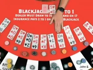 Black jack dealing on red table