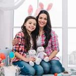 Mother daughter with stuffed bunnies