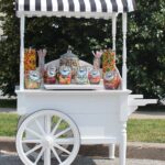 vintage candy cart park Vintage candy cart in a park