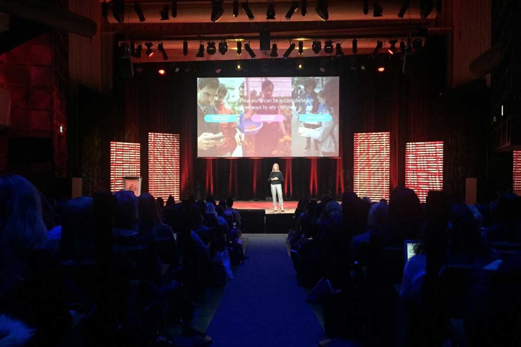 Conference room speaker with attendees