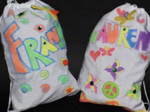 Two decorated draw sacks